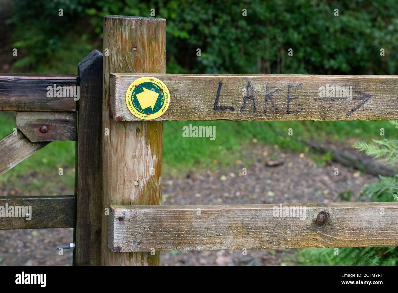 walking in the English Lake District - Lake District National Park public footpath marker and lake sign,  Ennerdale Water,  Lake District, England, UK Stock Photo