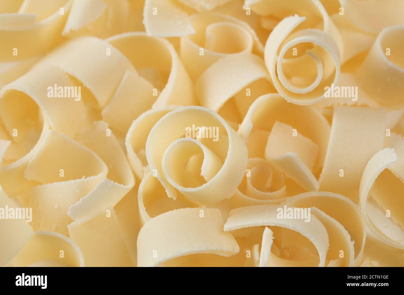 Parmesan flakes background Stock Photo Alamy