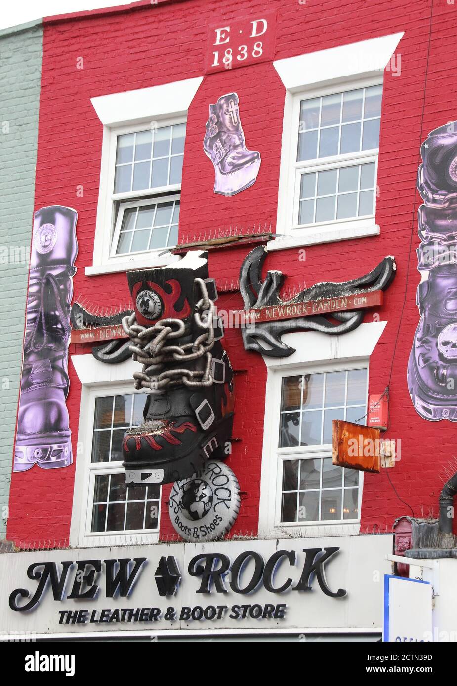 London, UK. 23rd Sep, 2020. Boots and chains are depicted in this artwork above New Rock store in the High Street.A huge variety of Street Art of all kinds can be found almost around every corner in one of London's artistic and cultural hotbeds of Camden Town. Credit: SOPA Images Limited/Alamy Live News Stock Photo
