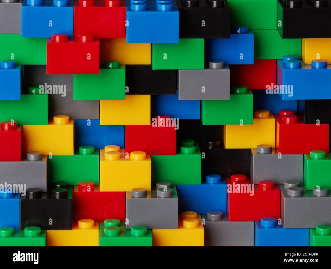 Plastic toy blocks on white background Stock Photo - Alamy