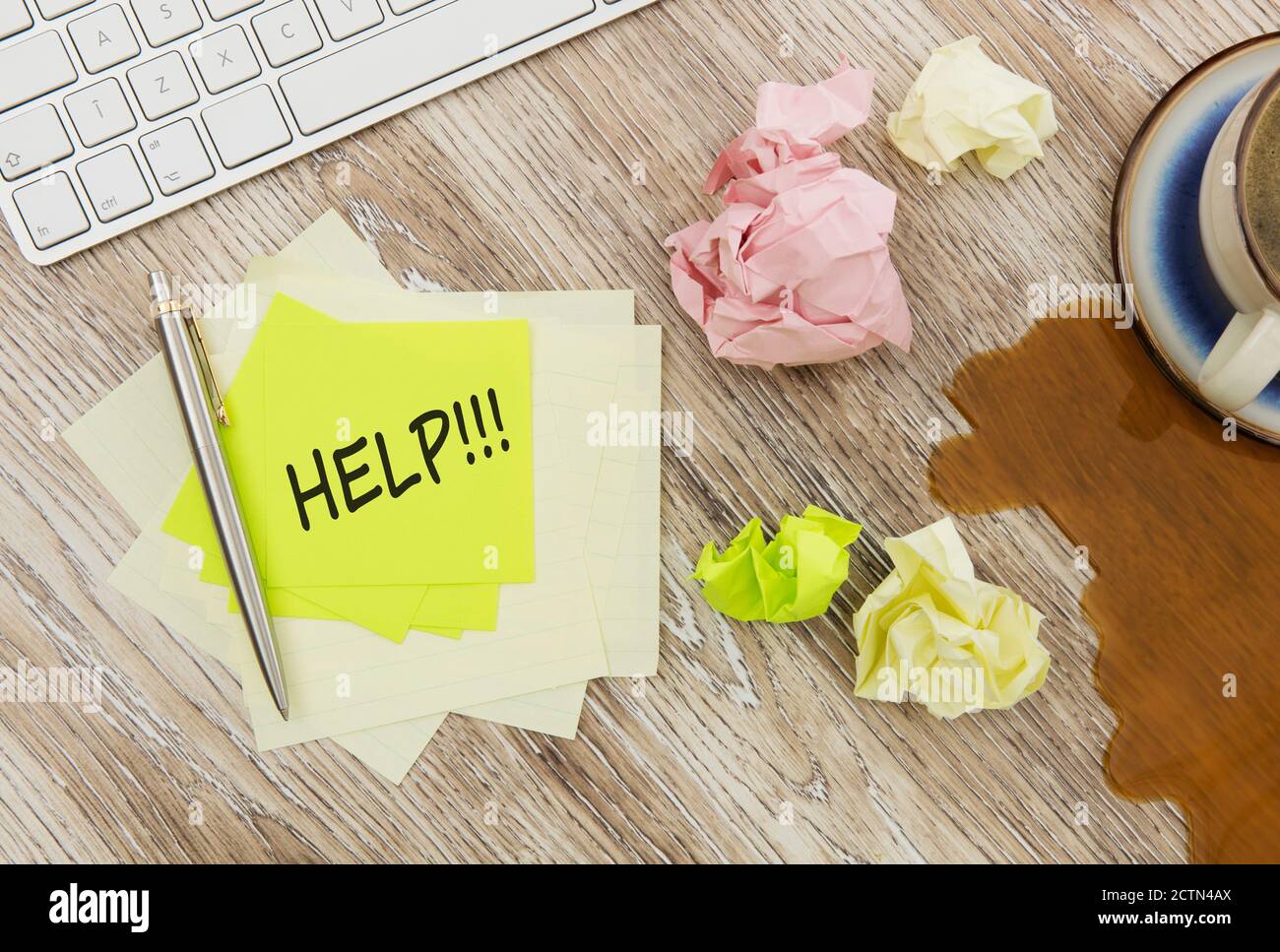 Help message on adhesive note on office table Stock Photo - Alamy