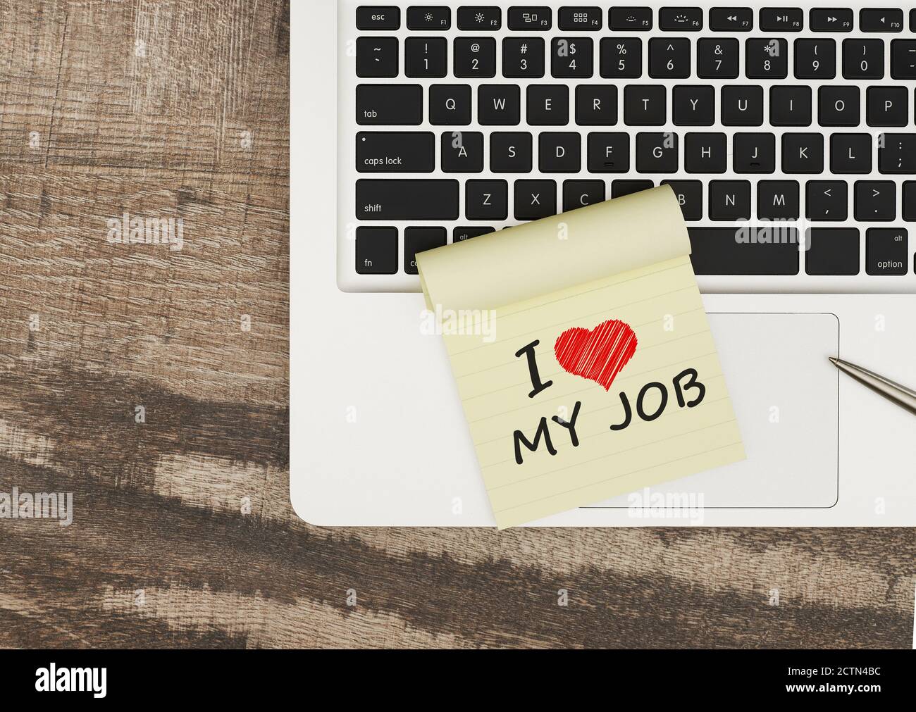 I love my job message on adhesive note on office table Stock Photo - Alamy
