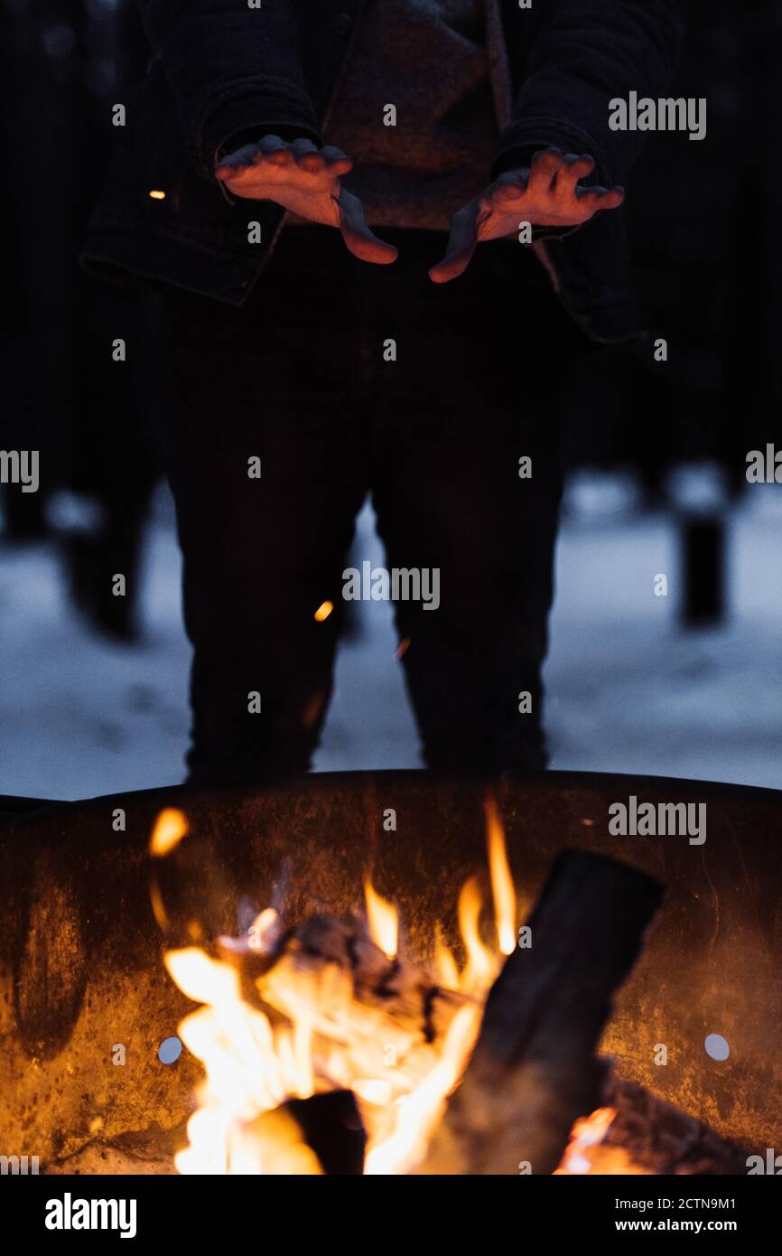 Hand Over Fire Person warming hands over bonfire hi-res stock photography and images ...
