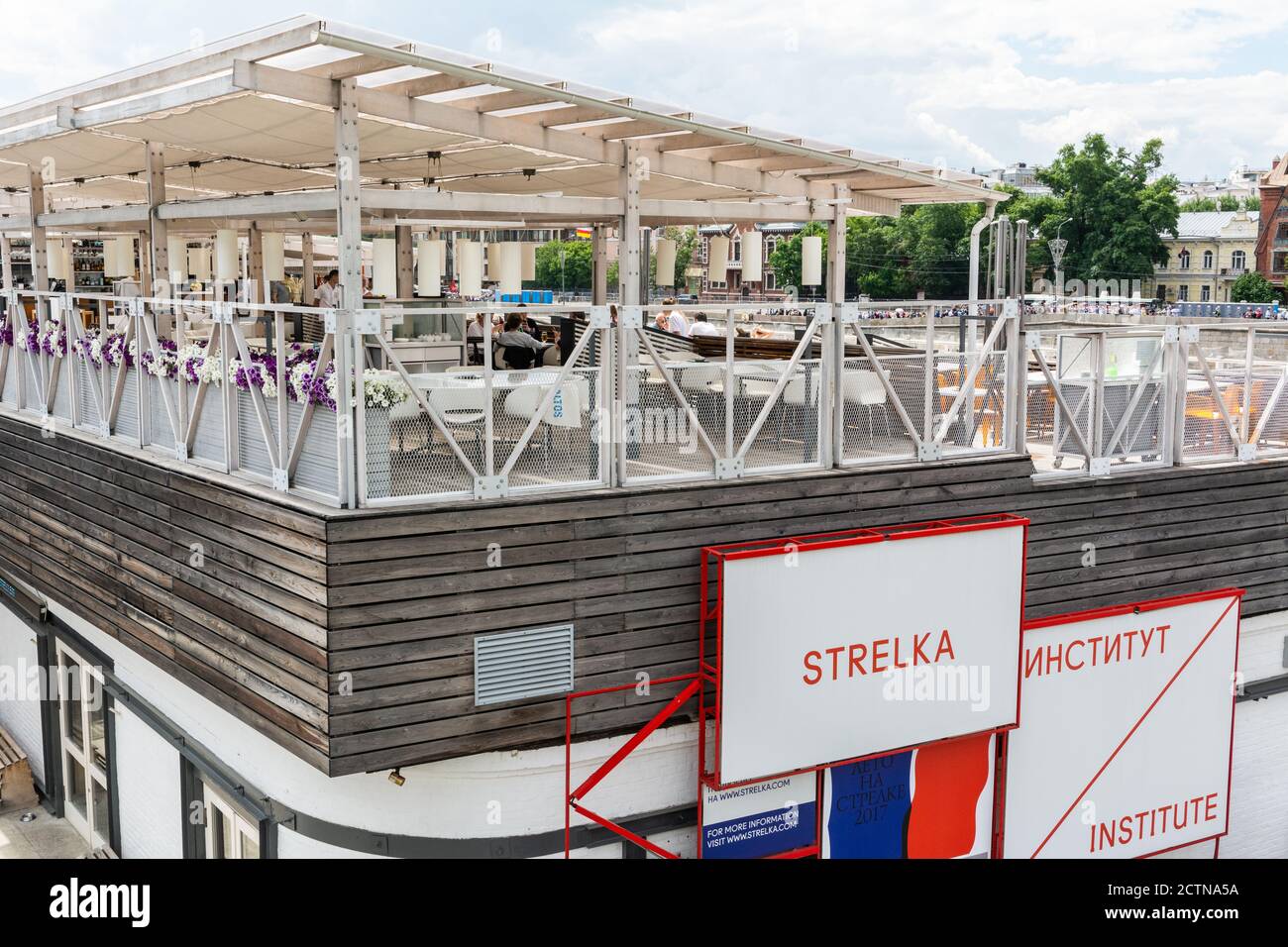 Moscow, Russia – June 11, 2017. Summer terrace of Strelka Bar, a part of Strelka Institute in Moscow. Strelka Institute for Media, Architecture and De Stock Photo