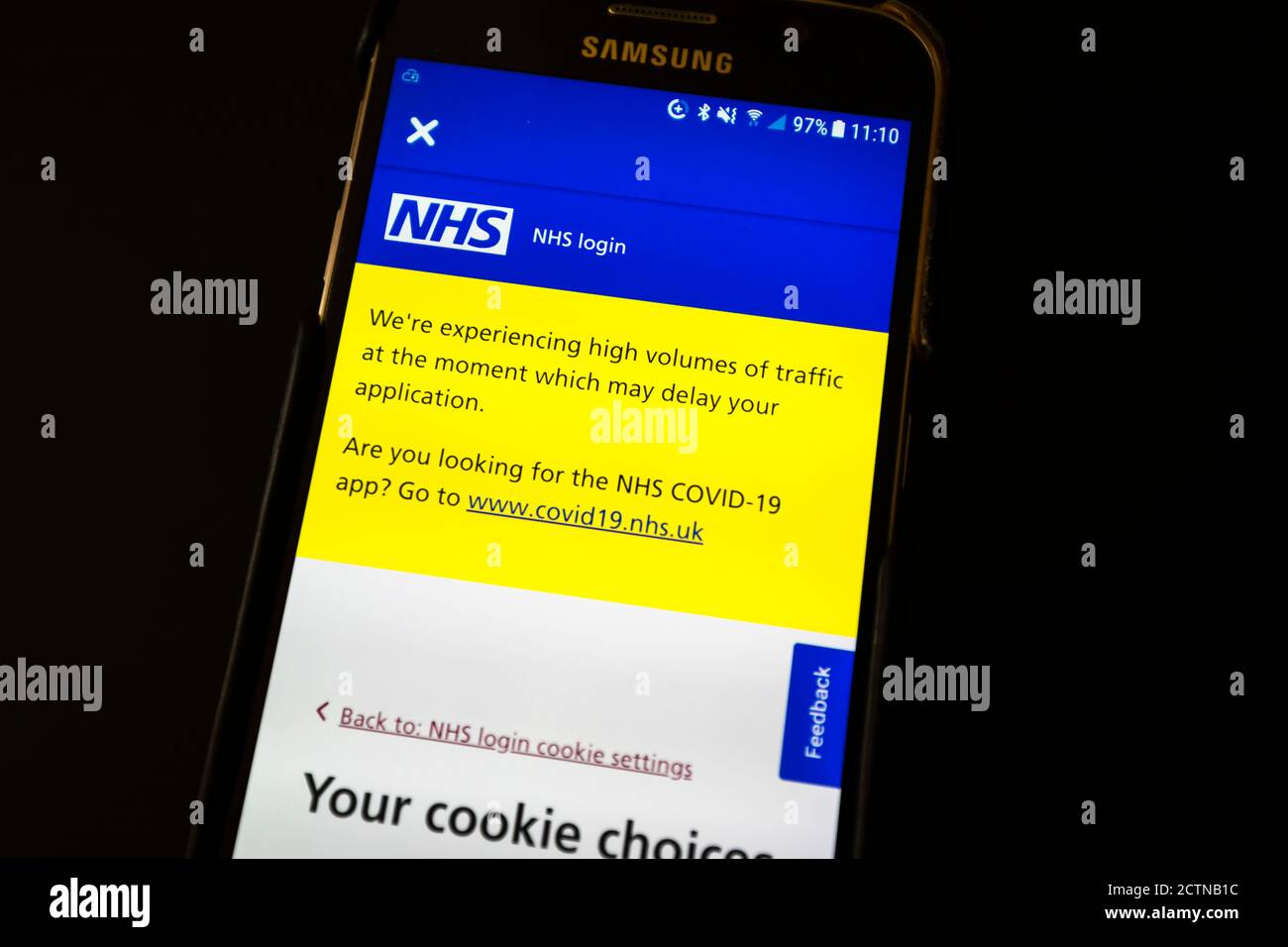 The Nhs Track And Trace App On The Screen Of An Android Mobile Phone With A Message That High Volumes Of Traffic May Delay Your Application Stock Photo Alamy