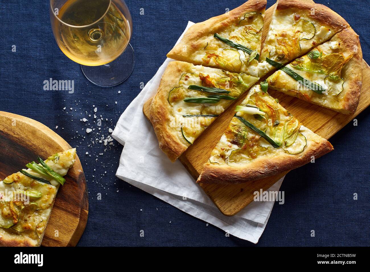 Vegetarian pizza with zucchini flowers, onion, courgette and cheese