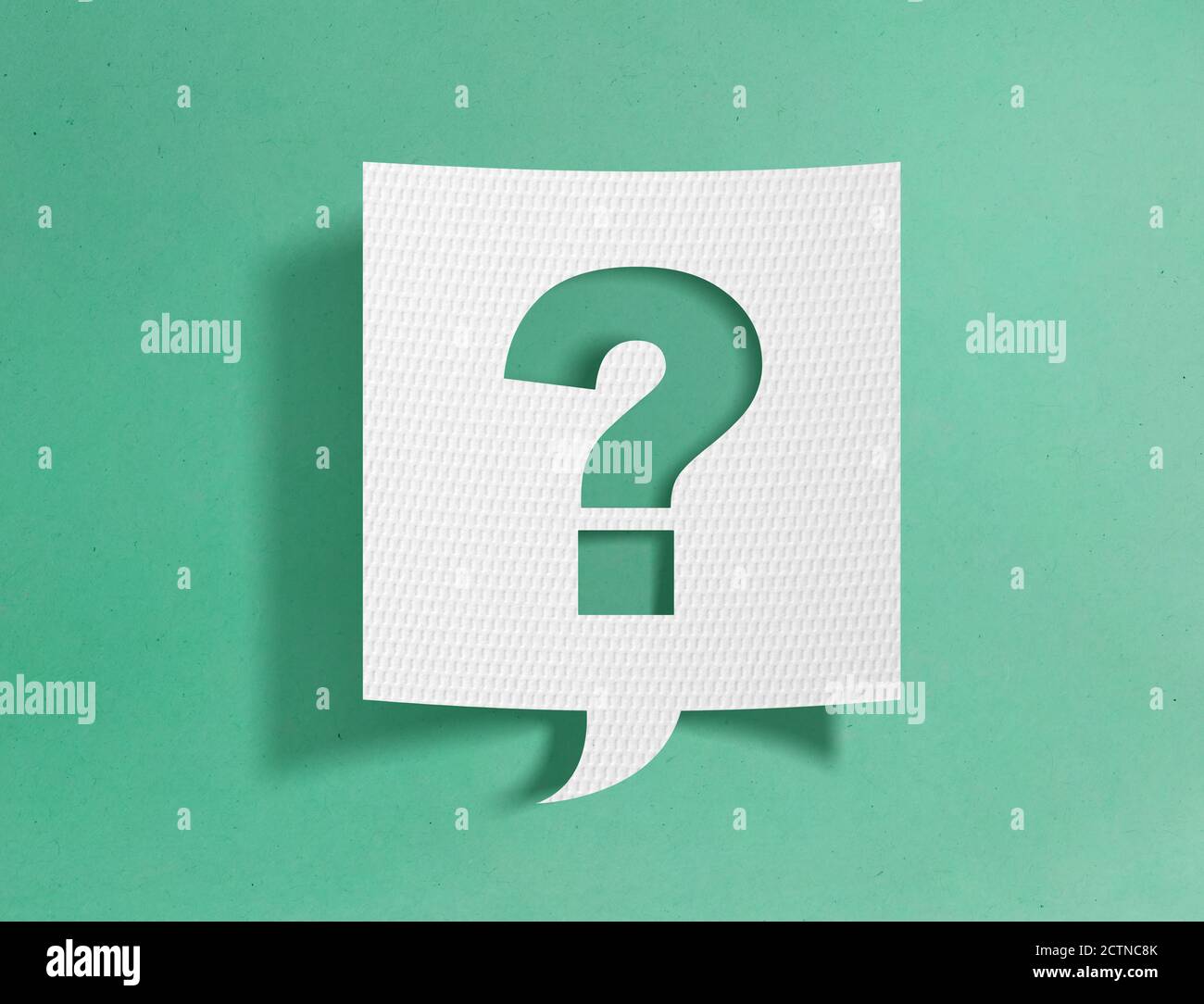 Speech bubble with question mark on green background Stock Photo