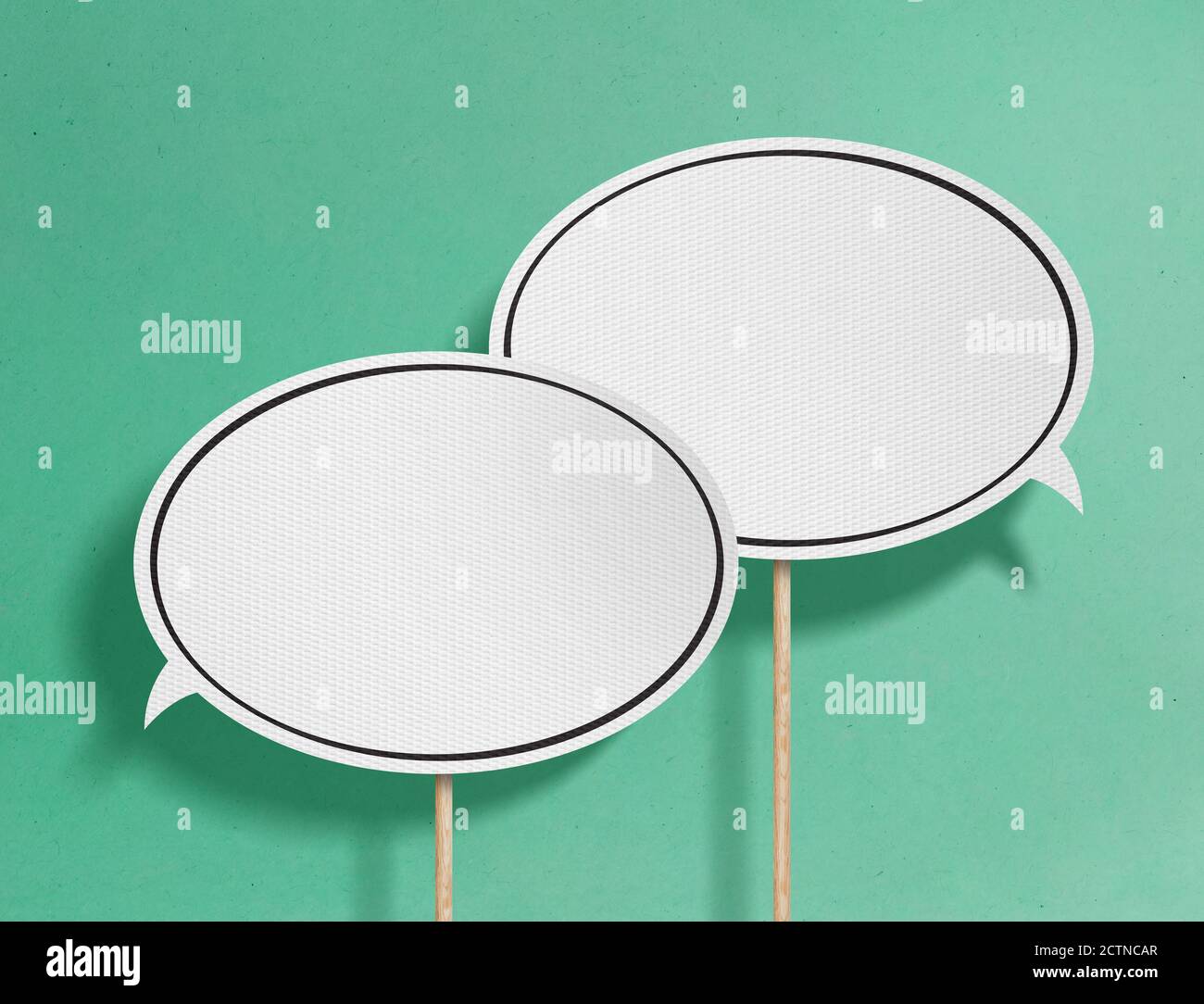 Speech bubbles on green background Stock Photo