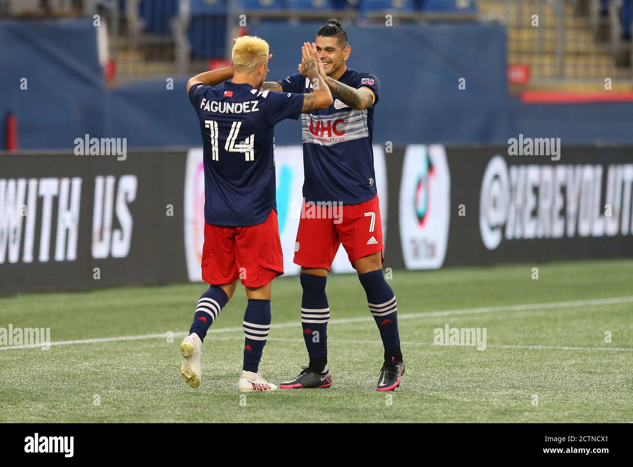 Gillette Stadium. 23rd Sep, 2020. MA, USA; New England Revolution forward Diego Fagundez (14) and New England Revolution forward Gustavo Bou (7) celebrate a goal during a MLS match between Montreal Impact and New England Revolution at Gillette Stadium. Anthony Nesmith/CSM/Alamy Live News Stock Photo