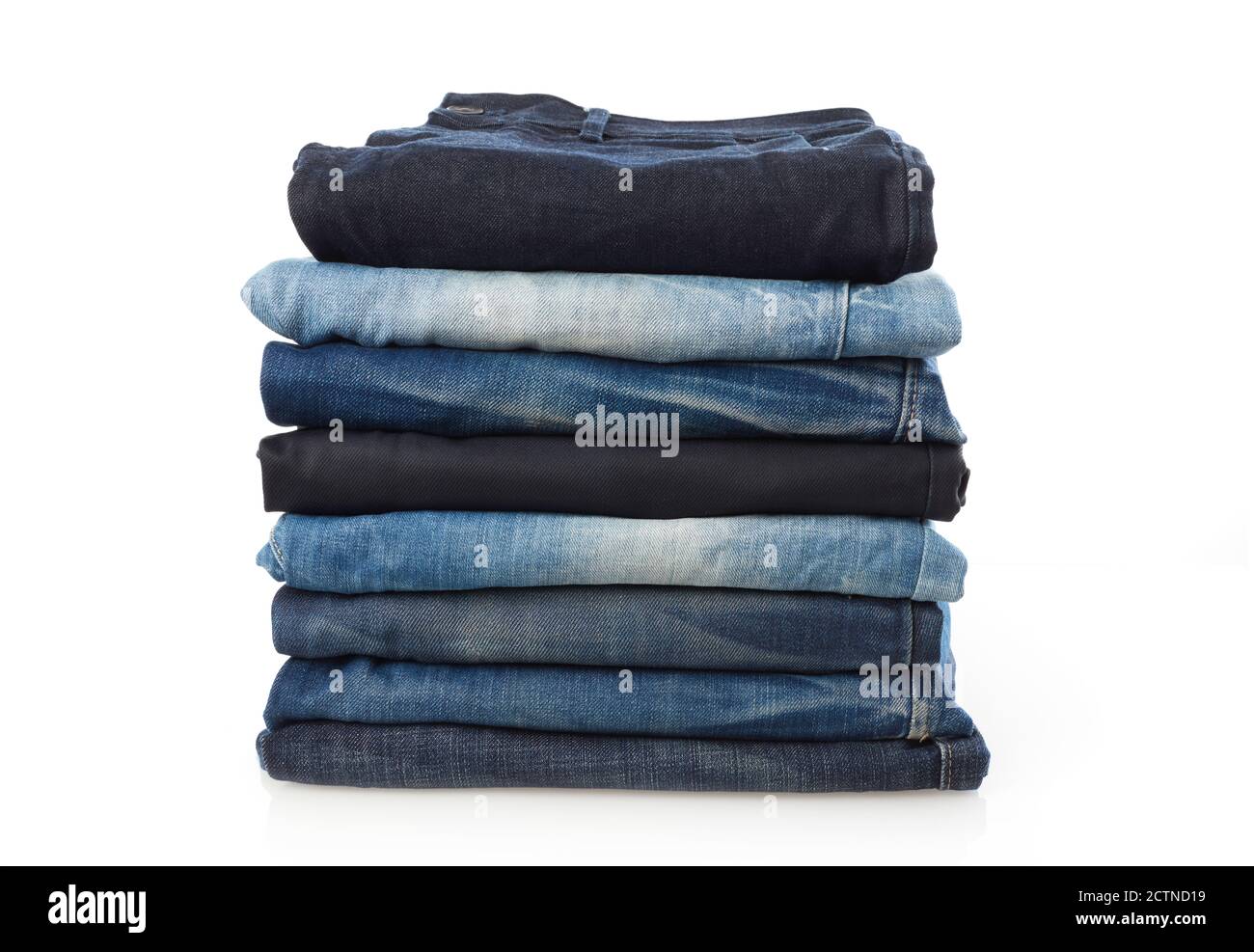 Stack of jeans isolated on white Stock Photo