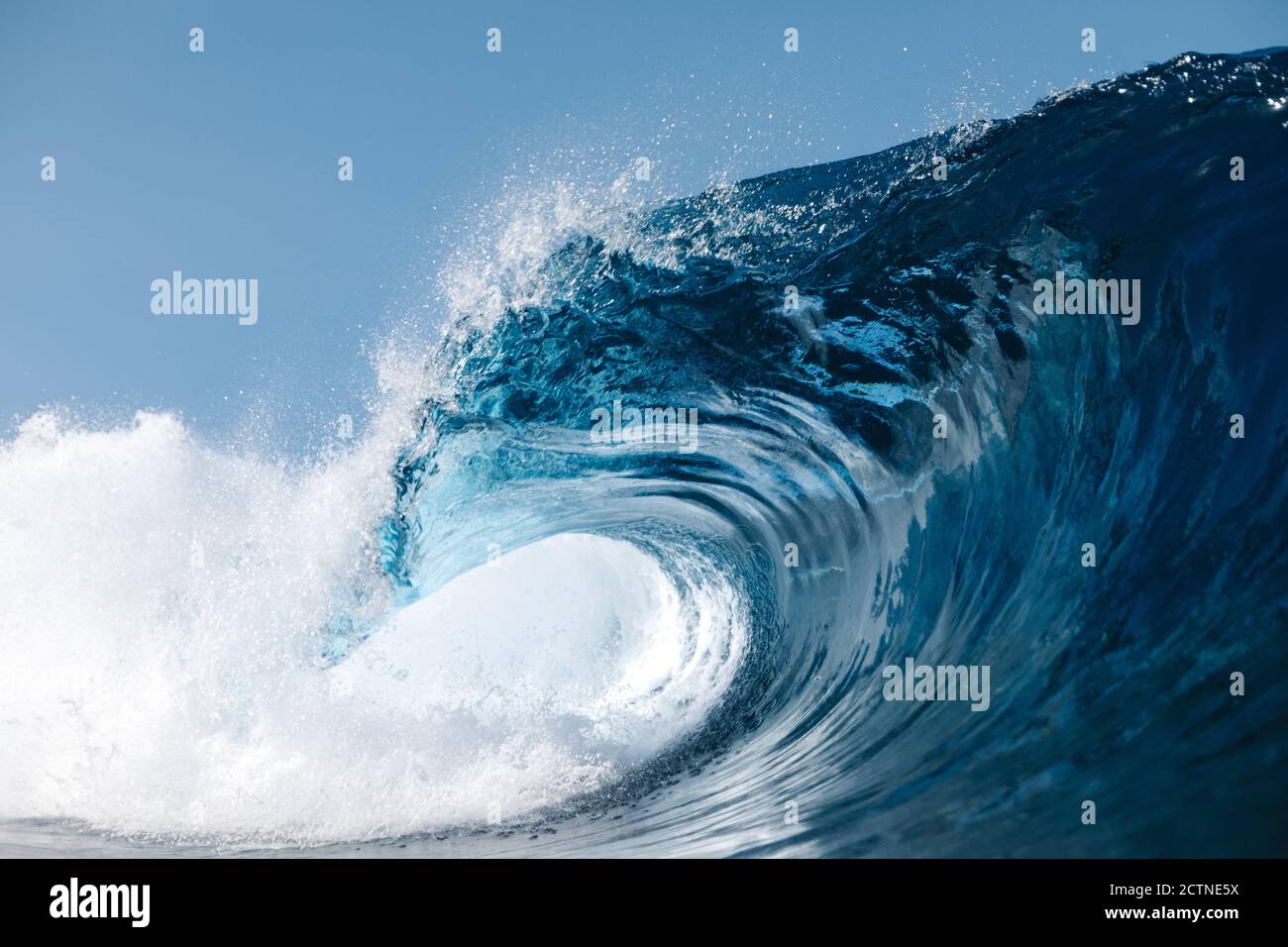 Powerful blue breaking ocean waves with white foam Stock Photo