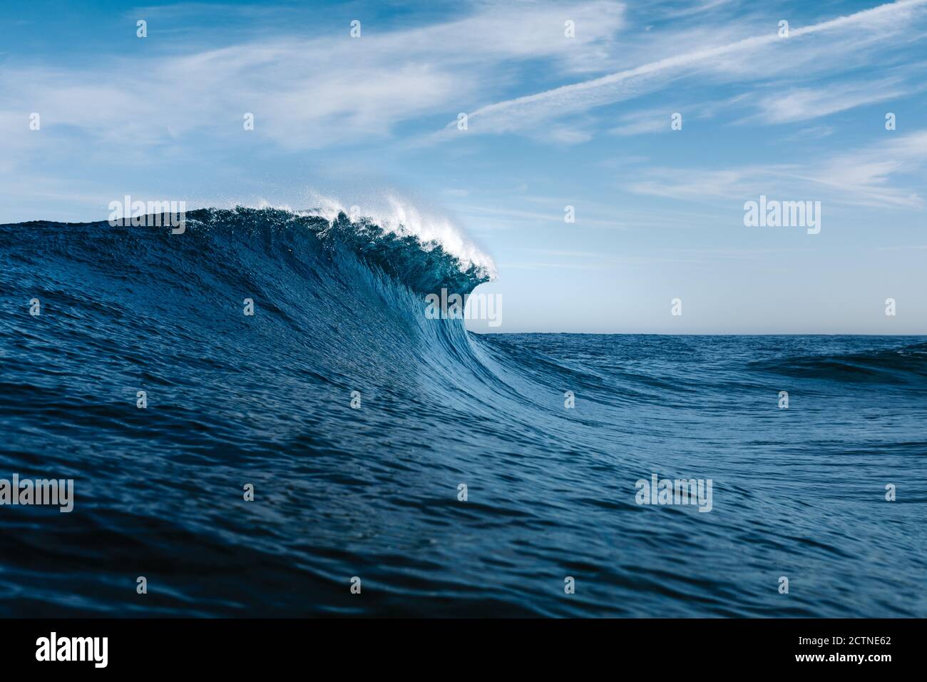 Powerful blue breaking ocean waves with white foam Stock Photo
