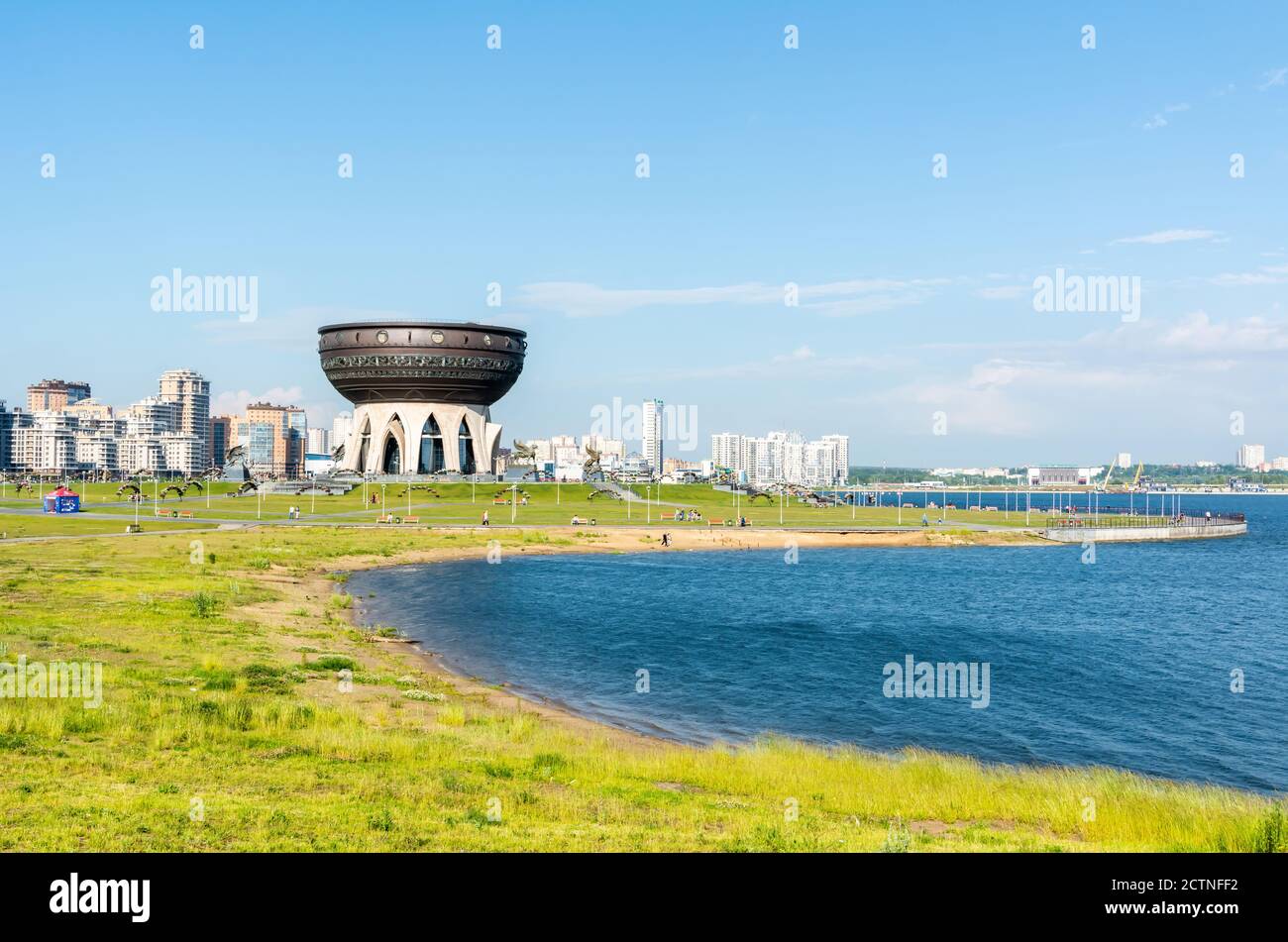 Kazan, Russia – June 27, 2017. View of Kazanka River bank toward Kazan Wedding Palace in Kazan, with buildings. Stock Photo