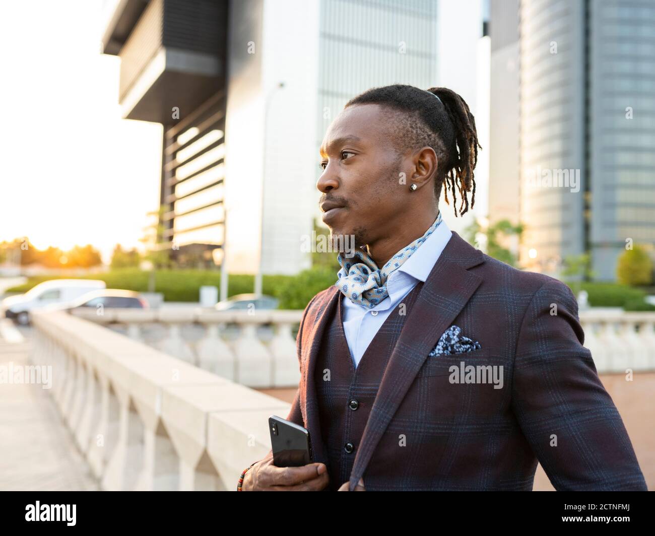 Serious African American male entrepreneur wearing classy suit standing ...