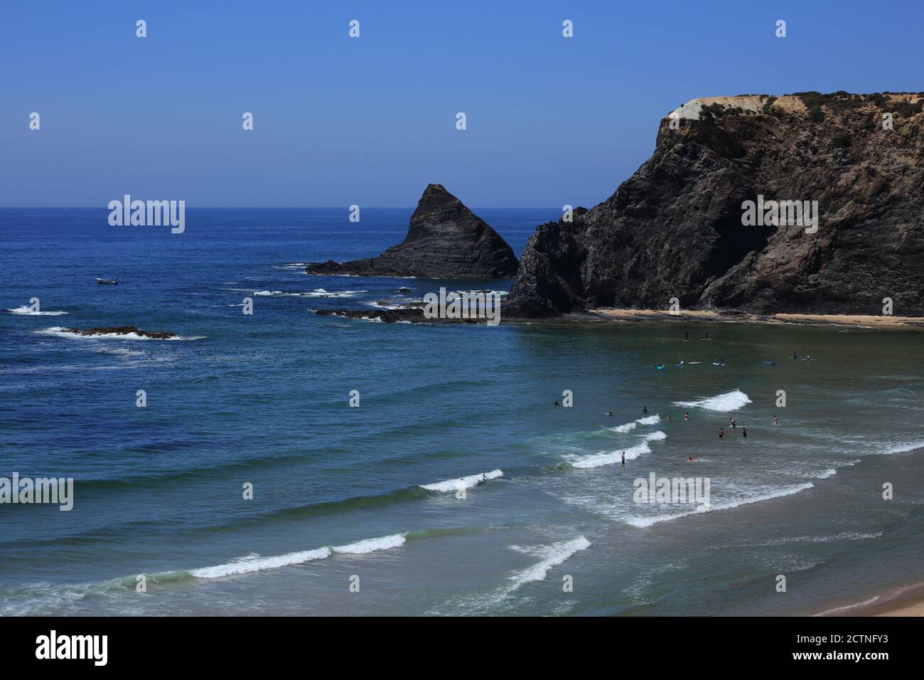 Portugal, Algarve Region, Odeceixe, South-West Alentejo and Vicentine Coast Natural Park cliff top view of the waves washing onto Odeceixe beach. Stock Photo