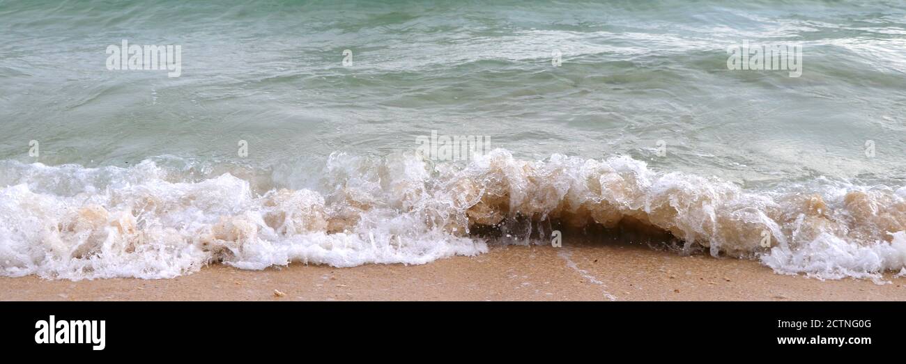 The waves in the sea that are swung to the shore banner. Stock Photo