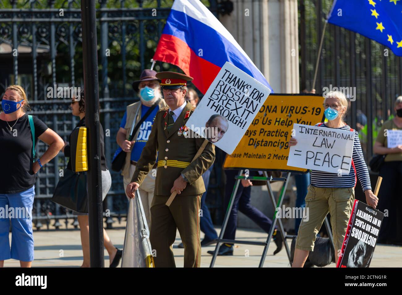 Steve Brey wearing russian military uniform protesting outside parliament, london, uk Stock Photo