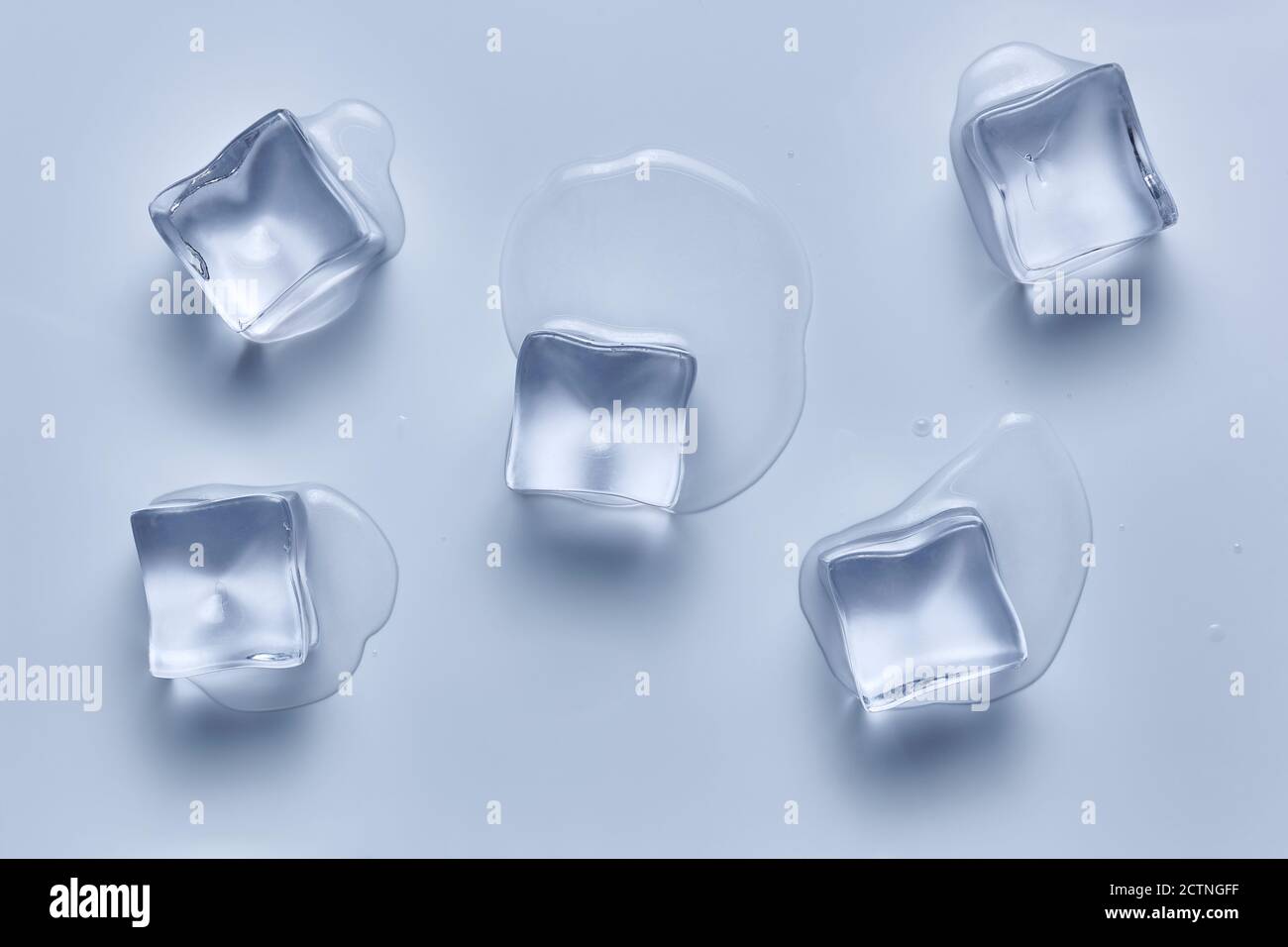Five ice cubes melting on a white background. Deep focus stacking. Ice