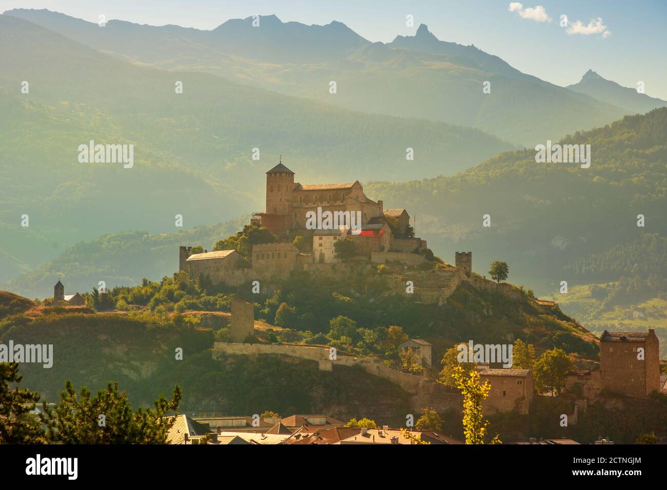 Terraced hills and vineyards aroud Tourbillon Castle and ruins of fortified village of Valere in Sion, capital of canton of Valais. Sion is located in Stock Photo