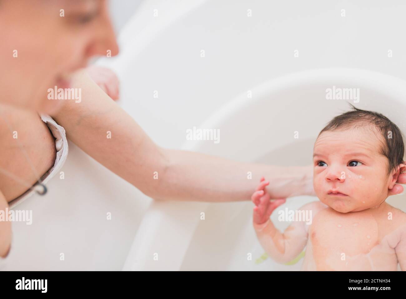 Woman bathing baby hires stock photography and images Alamy