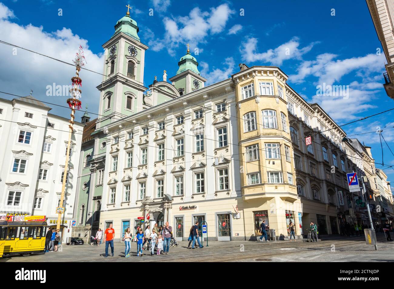 Linz, Austria – May 25, 2017. Street view on Hauptplatz square in Linz, toward Alter Dom, with people. Stock Photo