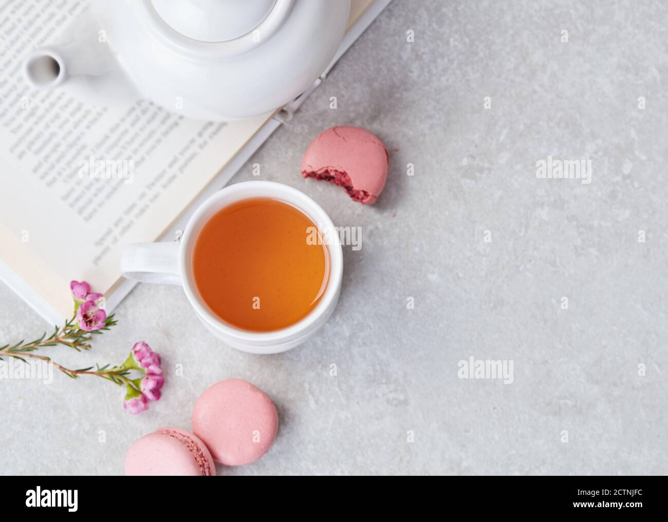 Tea and macaroons on table Stock Photo