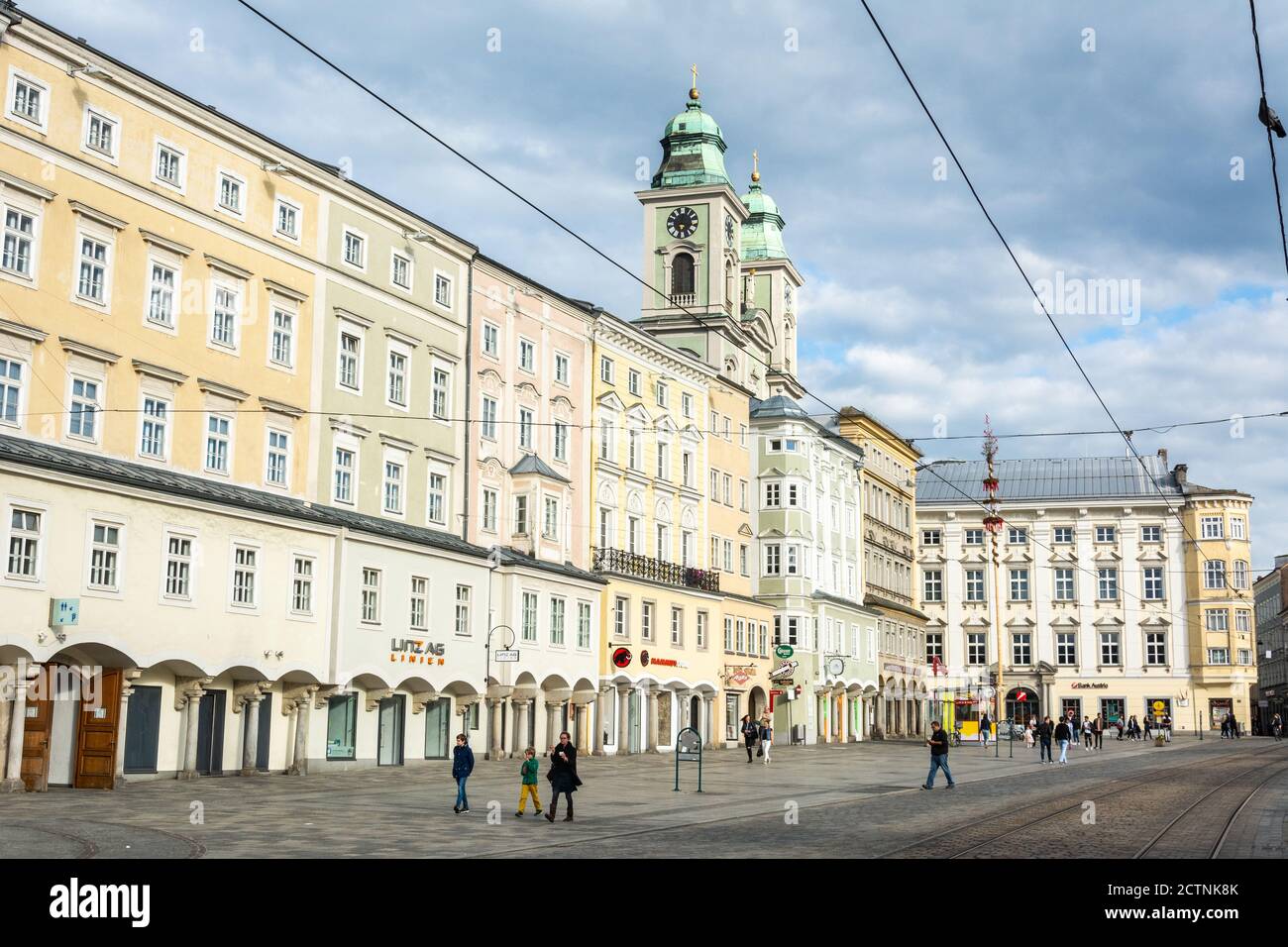 Linz, Austria – May 25, 2017. View of Hauptplatz square in Linz, toward Alter Dom, with people. Stock Photo