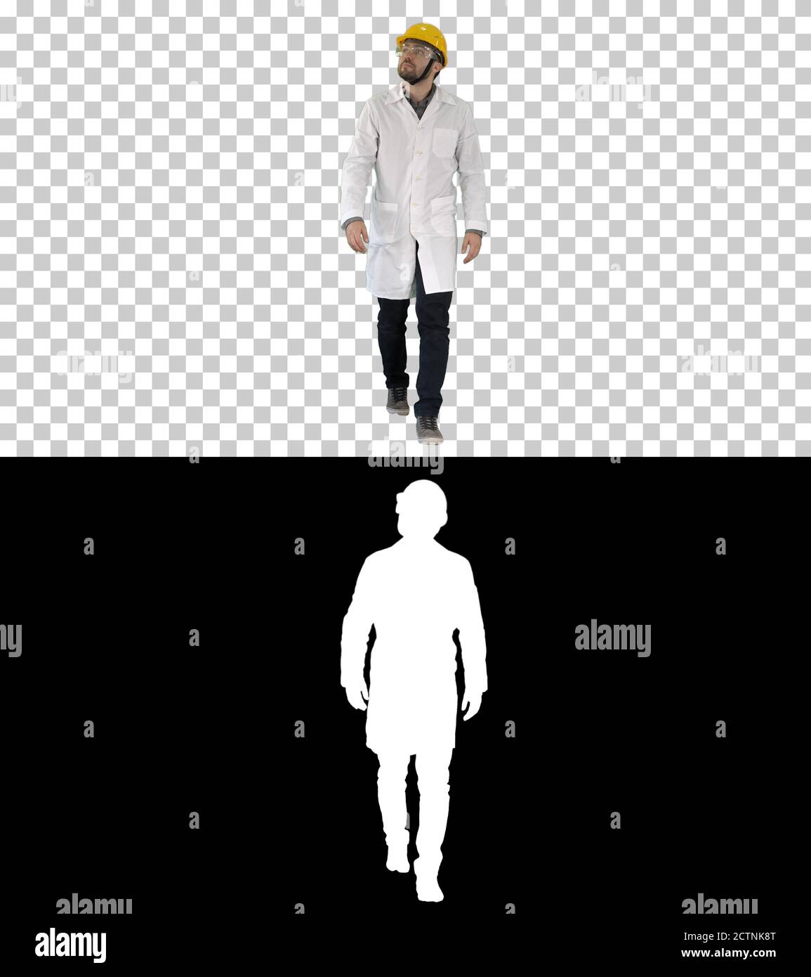 Engineer putting on protactive glasses while walking, Alpha Chan Stock Photo