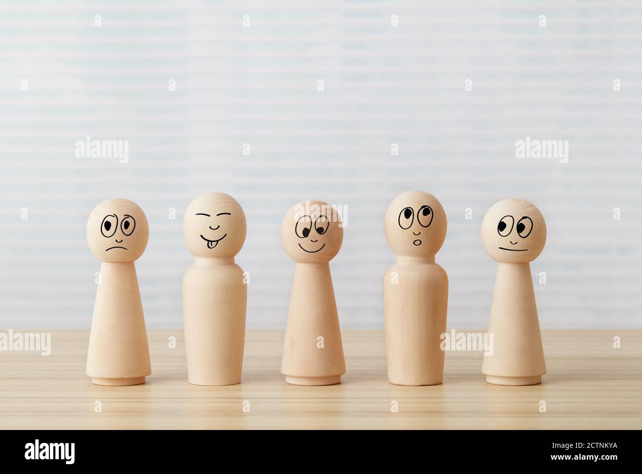 Wooden people figures on desk table Stock Photo