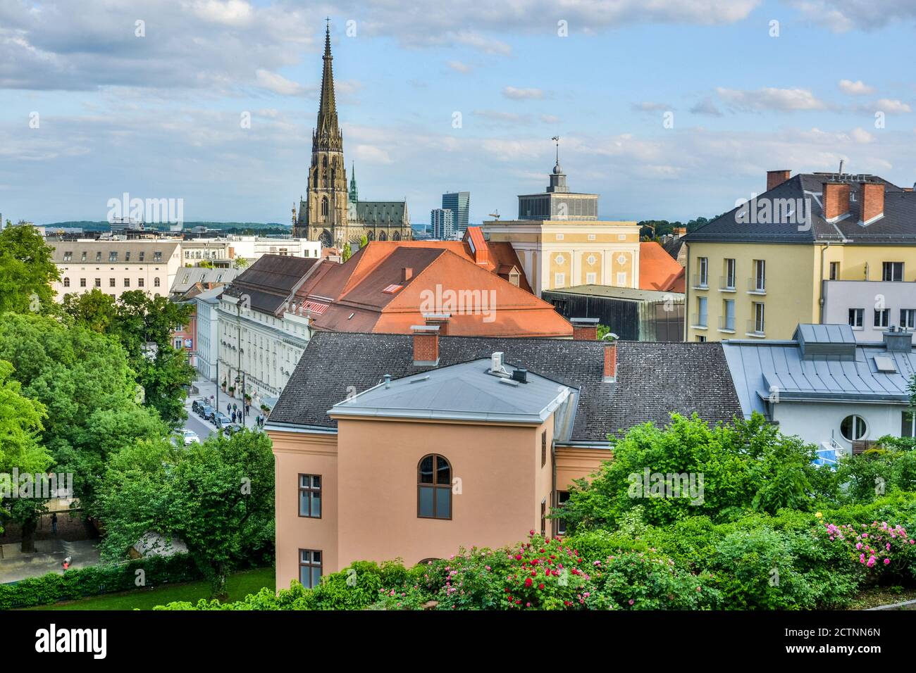 Linz, Austria – May 25, 2017. View over Linz, with steeple of New Cathedral, historic buildings and people. Stock Photo