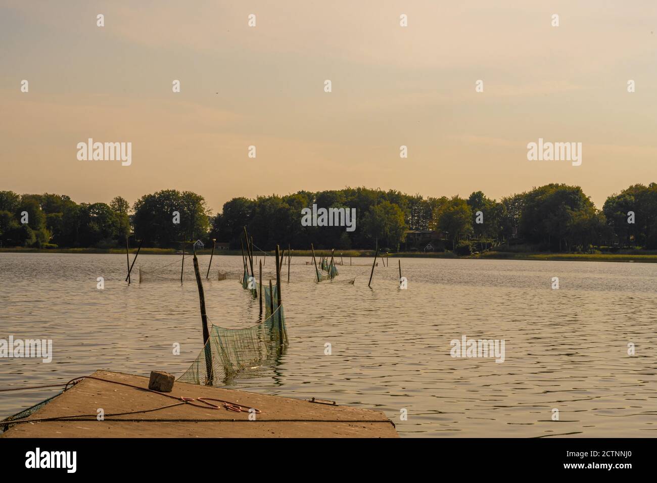 Beautiful sunset scenery of a fishing net in a lake one of the latest ...