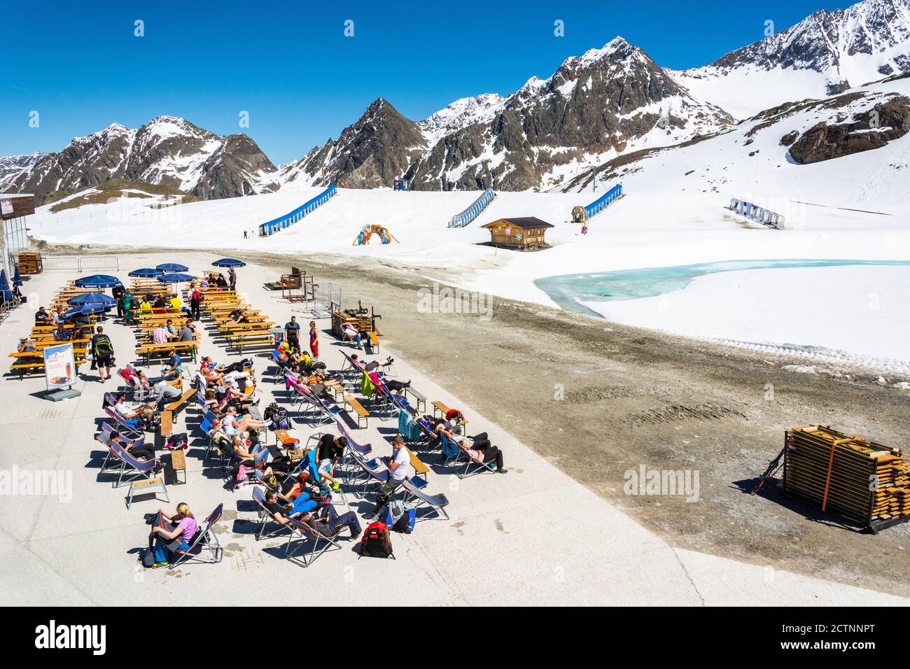 Neustift im Stubaital, Austria – May 27, 2017. Outdoor sitting area of Eisgrat mountain station at Stubai Glacier in Tyrol, Austria, with people. Stock Photo