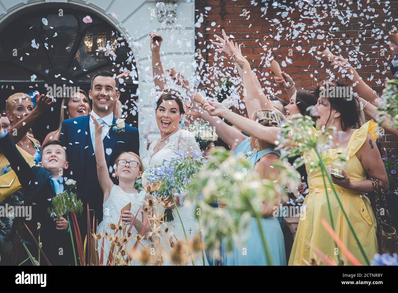 Confetti being thrown at a wedding at the Assembly House, Norwich Stock Photo