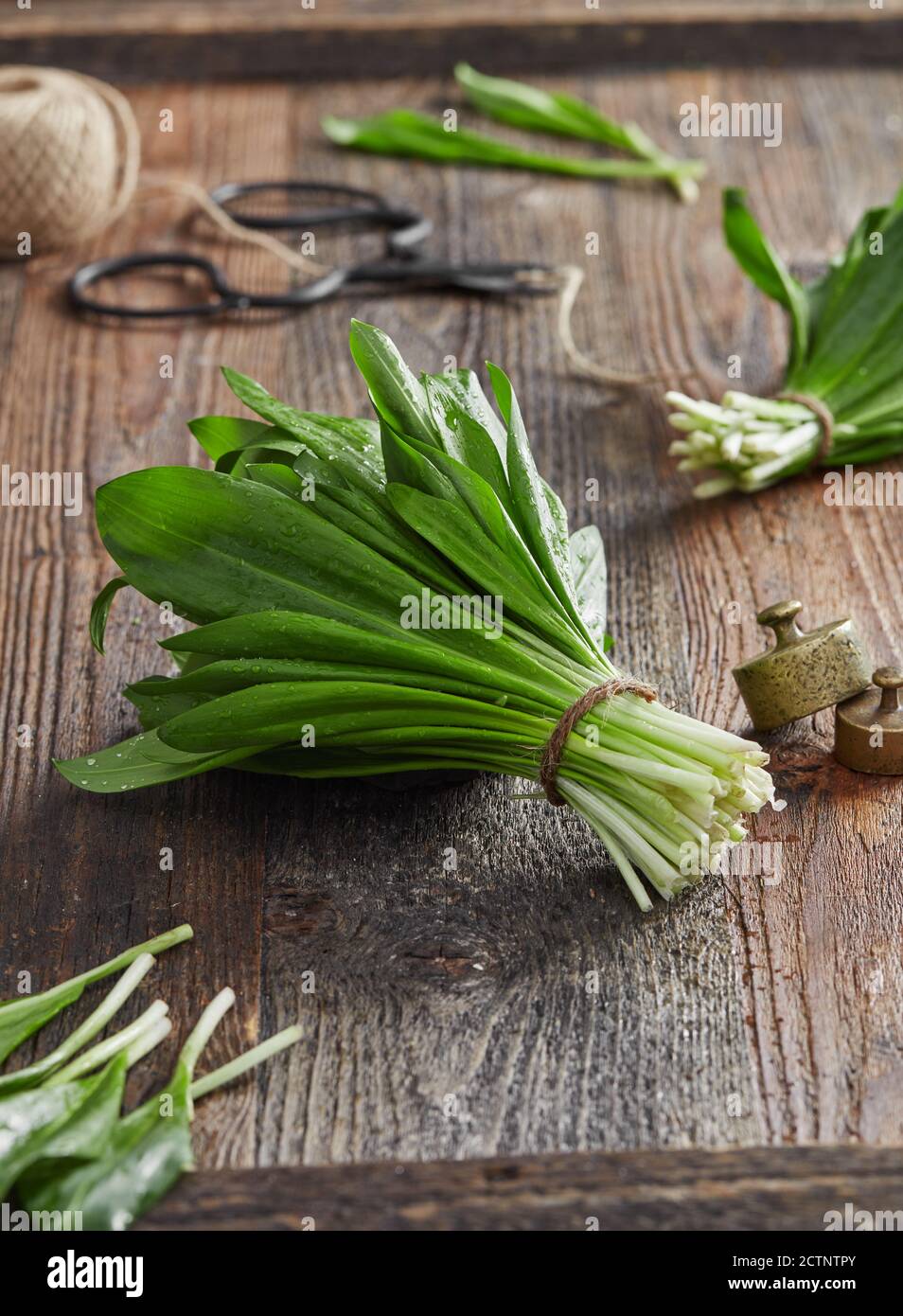 Wild garlic leafs on wood table Stock Photo