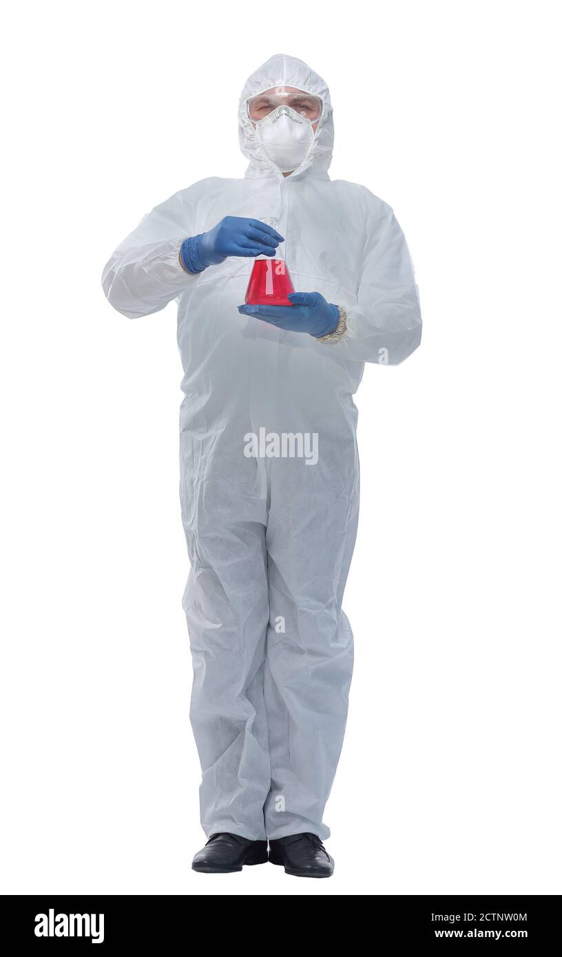 doctor in a biological-protective suit pointing to a vial of liquid Stock Photo