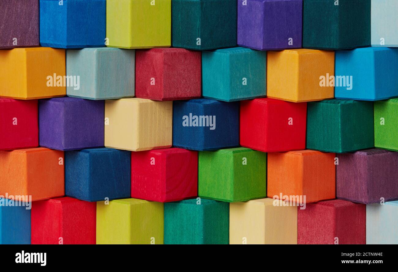 Multi-colored wooden toy blocks background Stock Photo - Alamy