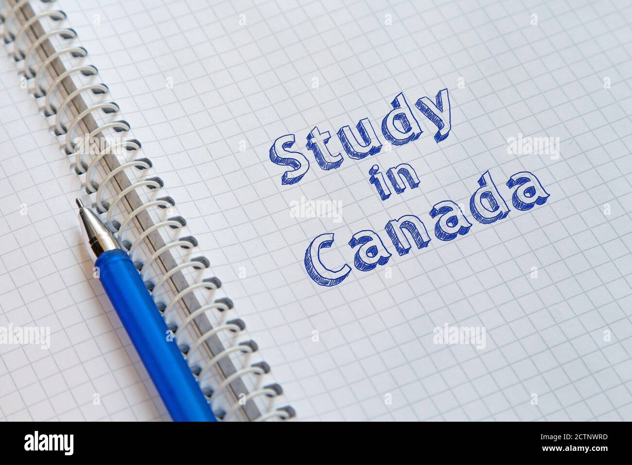Text Study in Canada handwritten on sheet of notebook Stock Photo