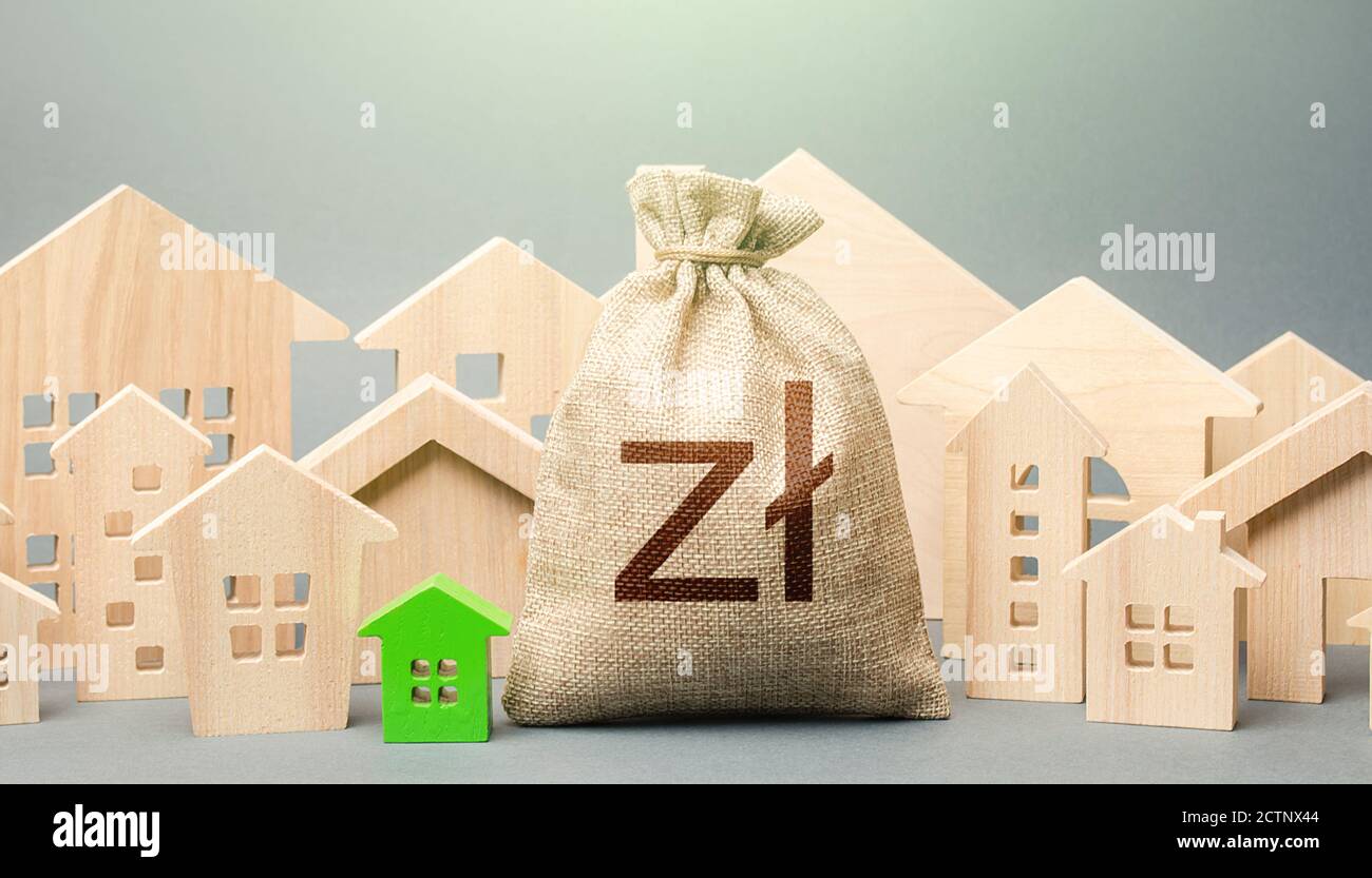Polish zloty money bag and a city of house figures. Investments. City