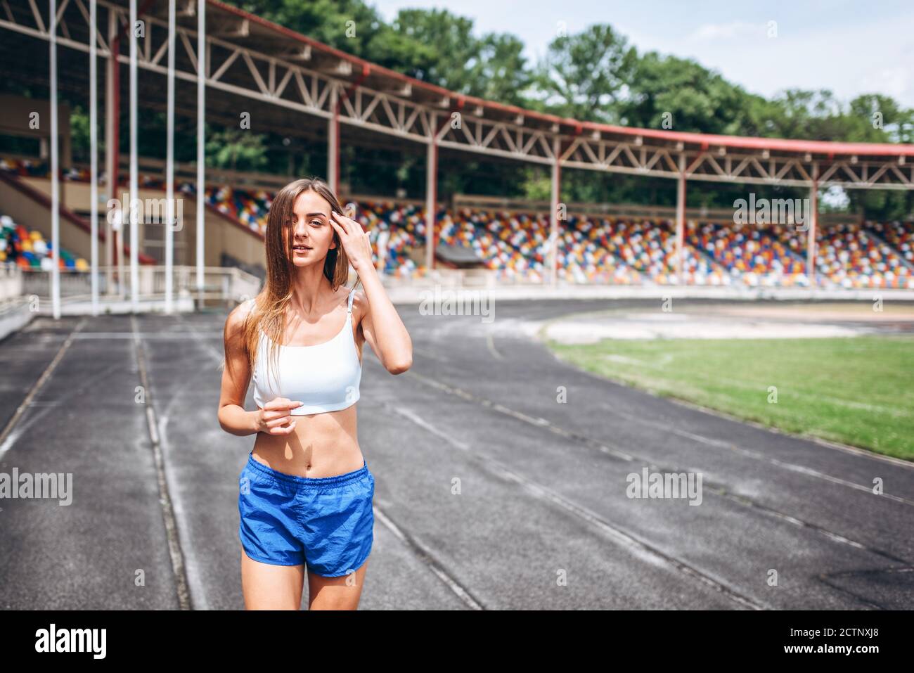 Pretty sporty girl running outdoor on the street Stock Photo - Alamy