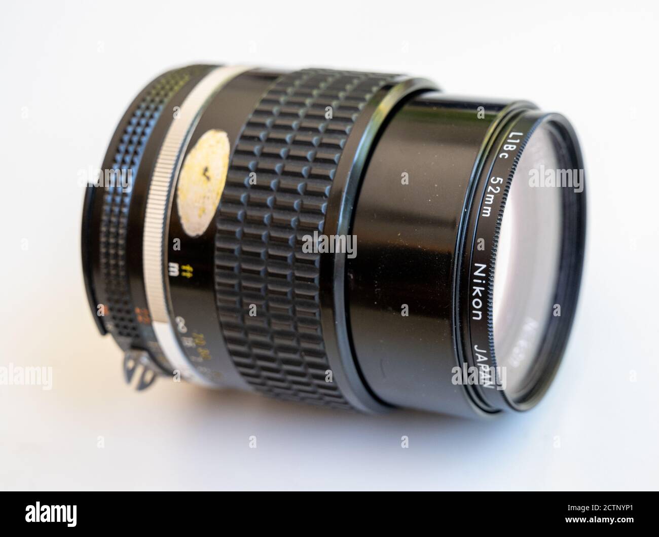 Nikon Nikkor 105mm 1:2.5 lens seen from the side. Stock Photo