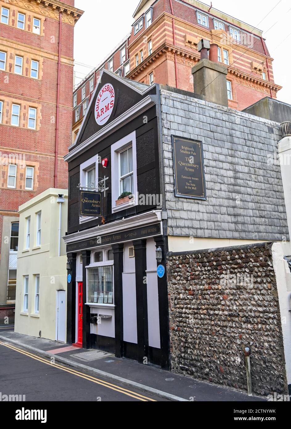 The Queensbury Arms formerly known as The Hole in the Wall is Brighton's smallest pub tucked behind the Metropole Hilton Hotel which is up for sale UK Stock Photo
