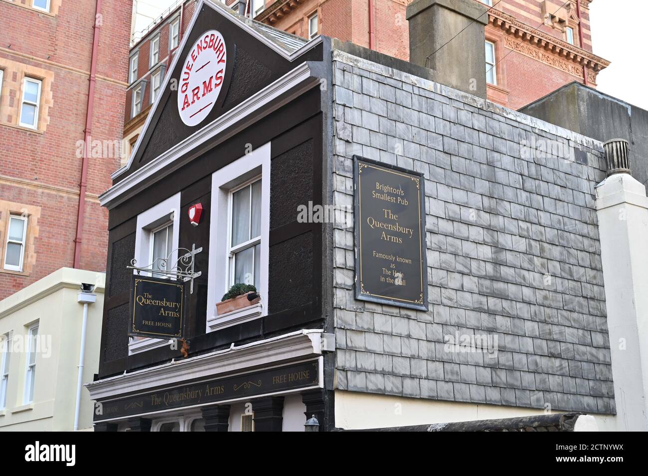 The Queensbury Arms formerly known as The Hole in the Wall is Brighton's smallest pub tucked behind the Metropole Hilton Hotel which is up for sale UK Stock Photo