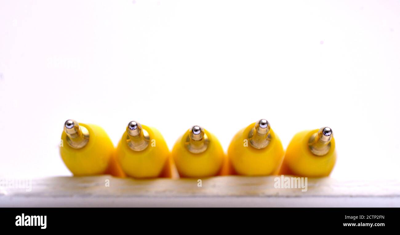 Yellow pen on white background image Stock Photo - Alamy