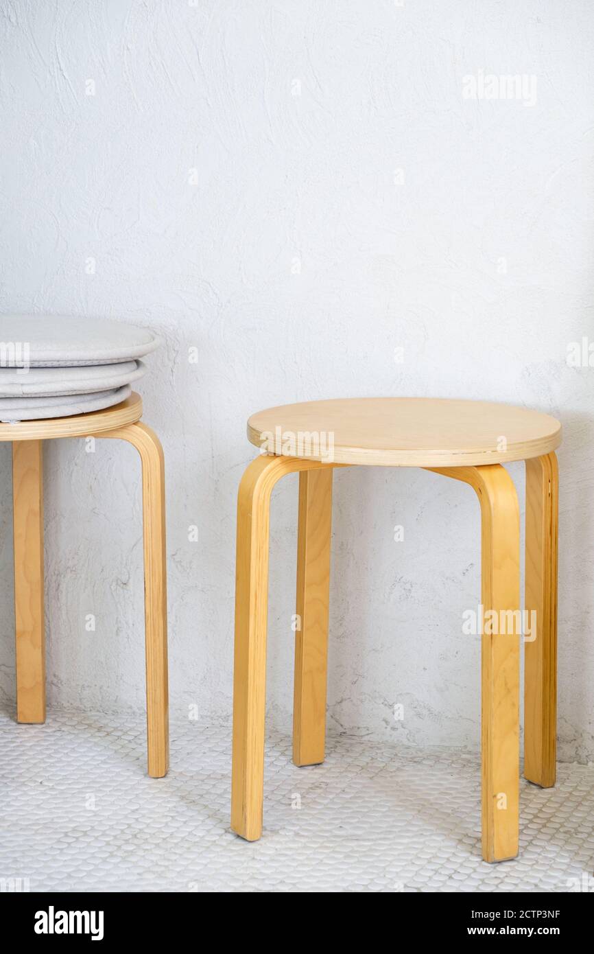 Wooden Stool In The Minimal Style Near The White Wall Of The Small Coffee Cafe Stock Photo Alamy