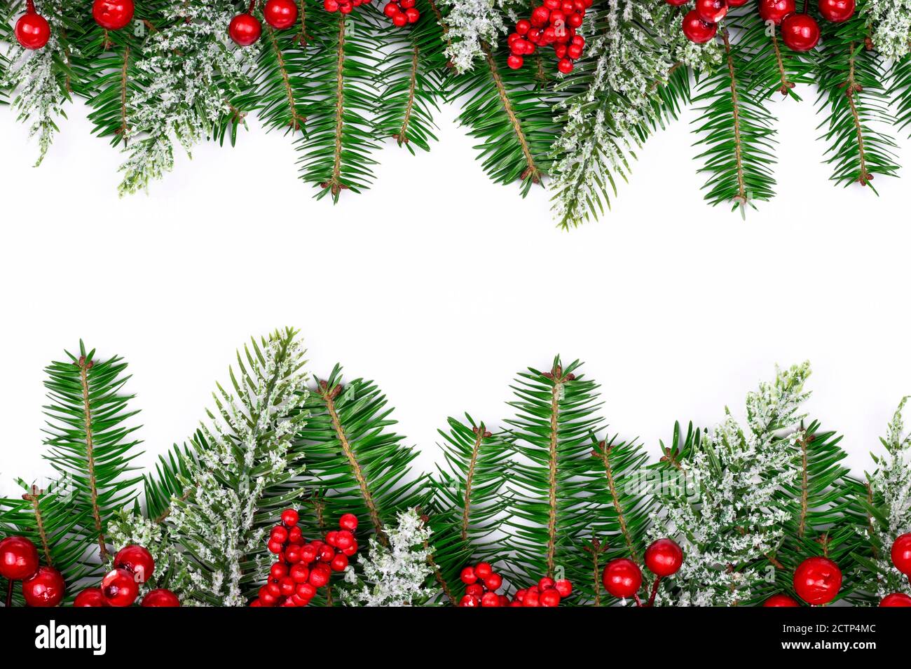 Christmas frame decorated with snowy fir branches, pine cones and red ...