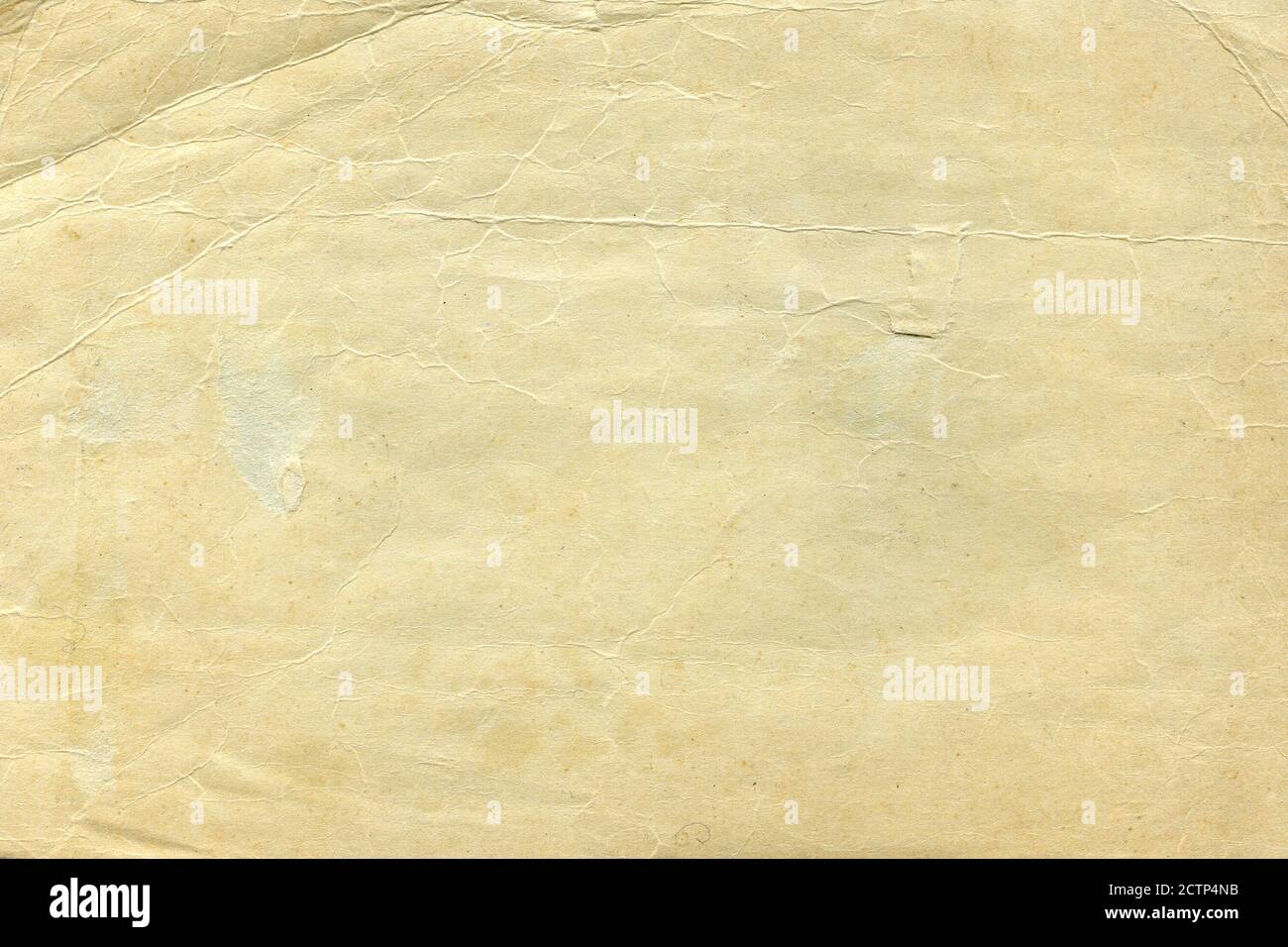 Vintage old worn paper blank background. Closeup Stock Photo