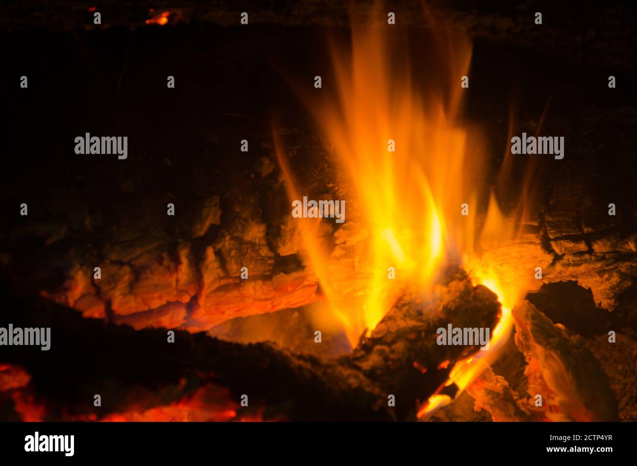 embers burn down in a hardwood fire. Stock Photo