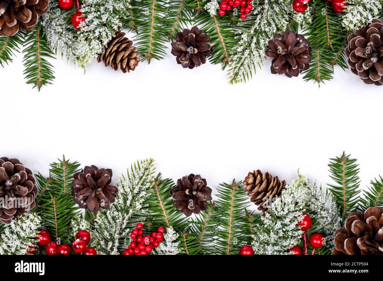 Christmas frame decorated with snowy fir branches, pine cones and red ...