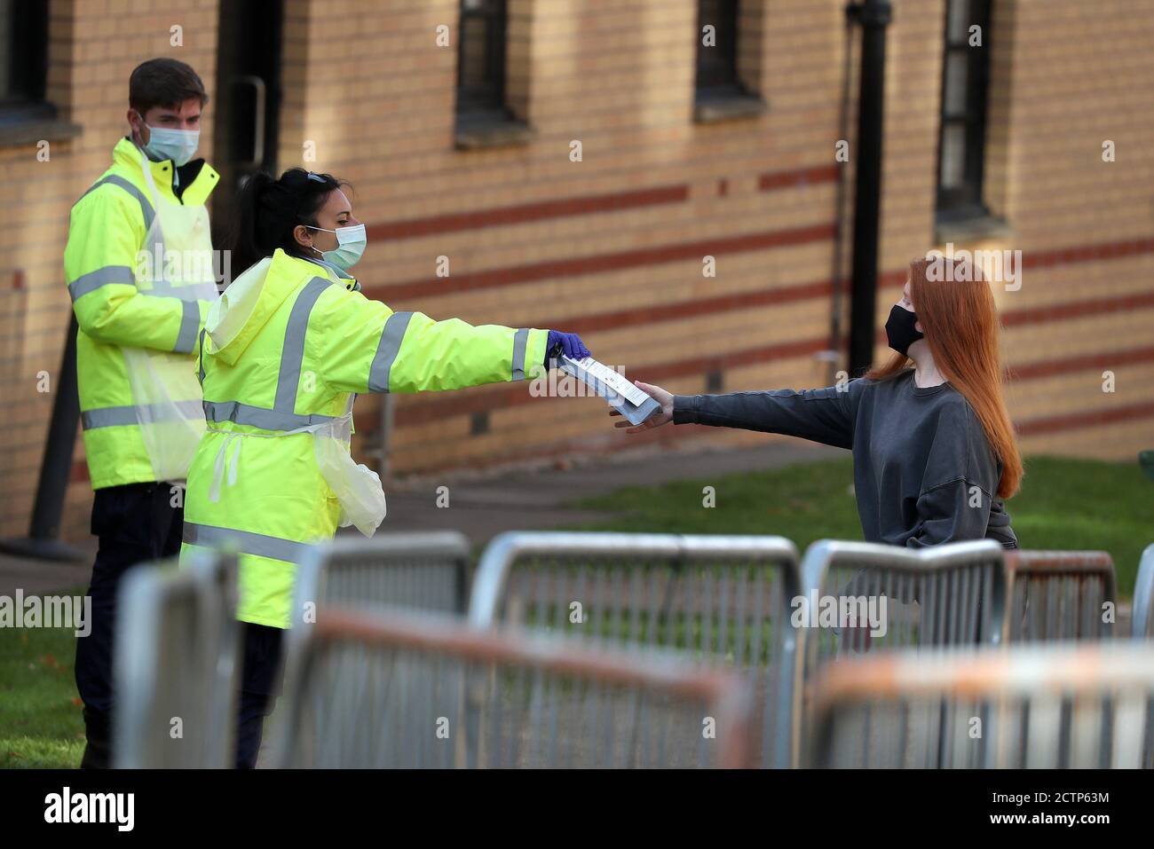 NHS staff hand out test kits to Glasgow University students as they