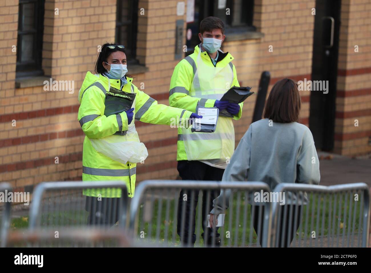 NHS staff hand out test kits to Glasgow University students as they